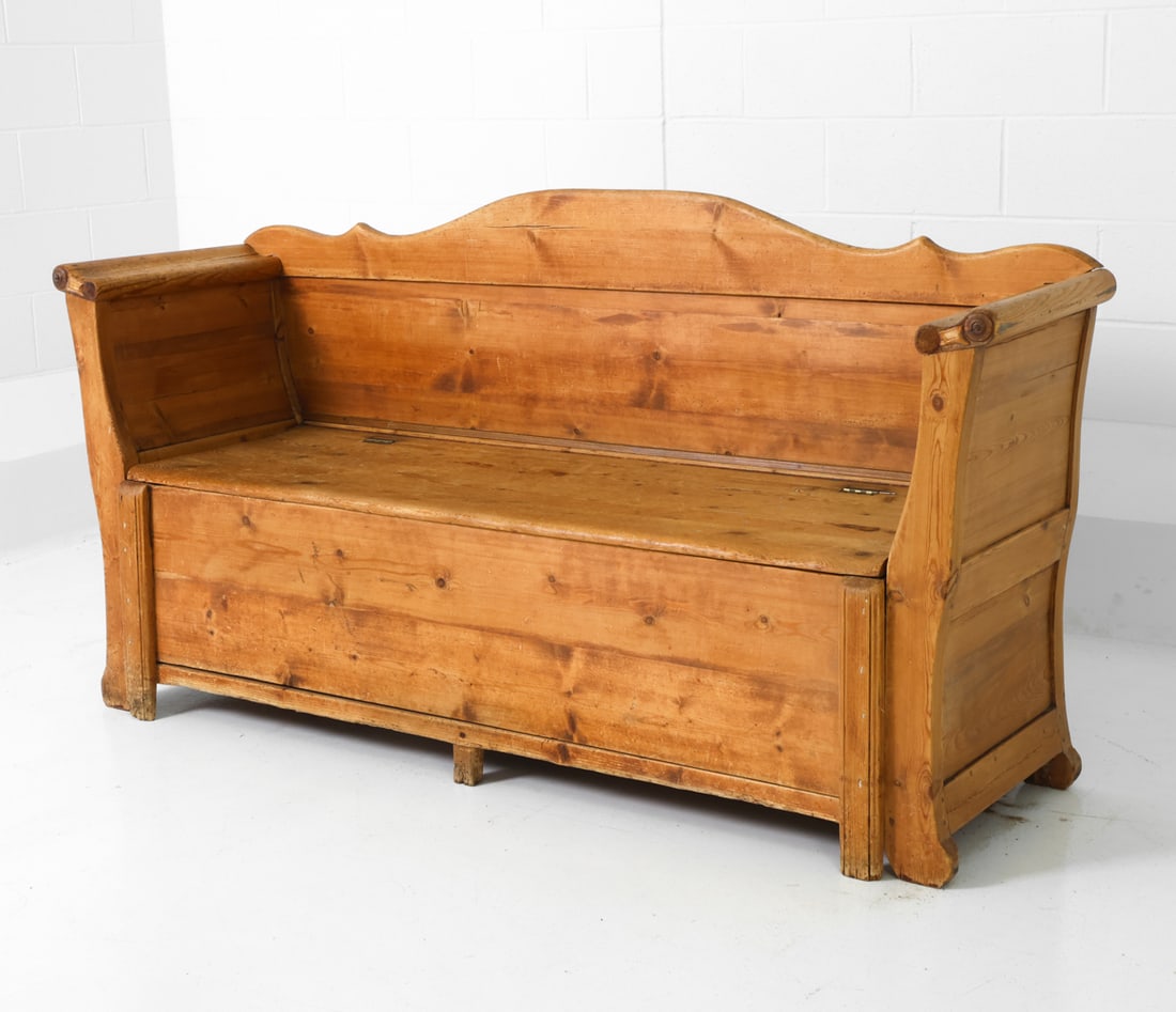 ANTIQUE SWEDISH PINE STORAGE BENCH: Farmhouse style bench or settle with a hinged storage compartment on the seat. Sweden, 20th century. Dimensions: H 36.5" x W 72" x D 18.5" x Sh 17.75" Condition: Stress cracks to seat and armrest, wat