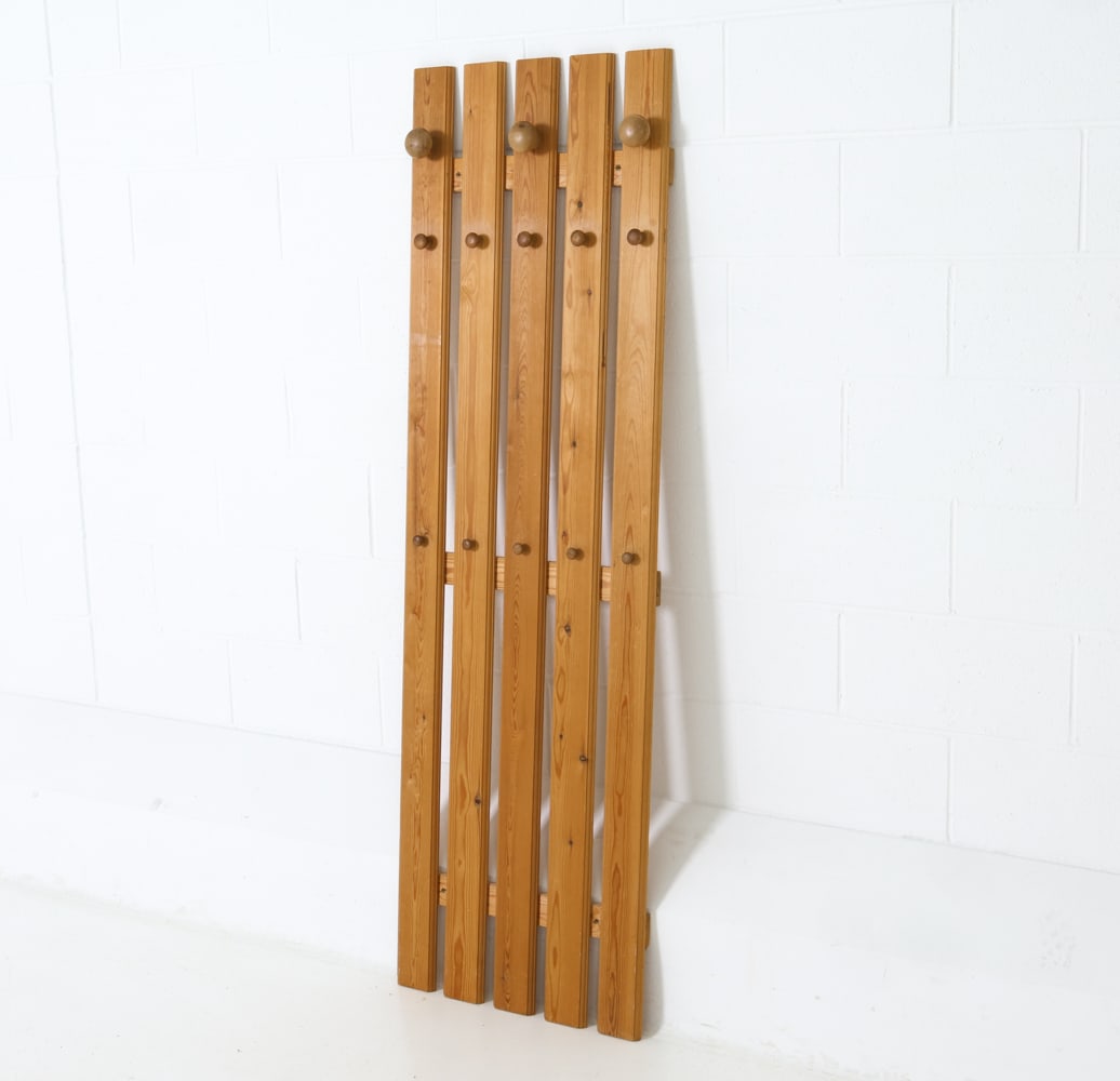 STYLE OF KARIN MOBRING SWEDISH PINE COAT RACK: Slatted pine frame wall coat rack. Rounded pegs for hanging. Sweden, circa 1970s. Dimensions: H 70.5" x W 21.5" x D 3.5" Condition: Wear consistent with age and use including scratches and dings.