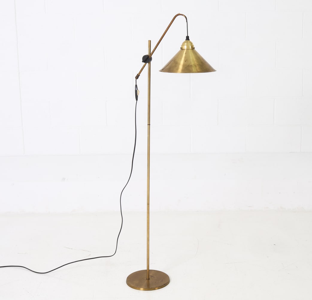 DANISH BRASS FLOOR LAMP C. 1970S: Brass tone finish. Cone-shaped shade with circular base. Denmark, circa 1970s. Dimensions: H 49" x W 9" x D 16" Conditions: Untested, cord cut, rubs and scuffs to base and stem, Wear consistent with