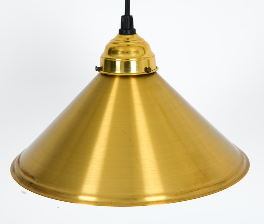 SCANDINAVIAN BRASS PENDANT LIGHT C. 1960S: Brass toned steel conical shade with black cord. Scandinavian, circa 1960s. Dimensions: H 6.5" x Dia. 10.5" Conditions: Not Tested, Wear consistent with age and use, including scratches.