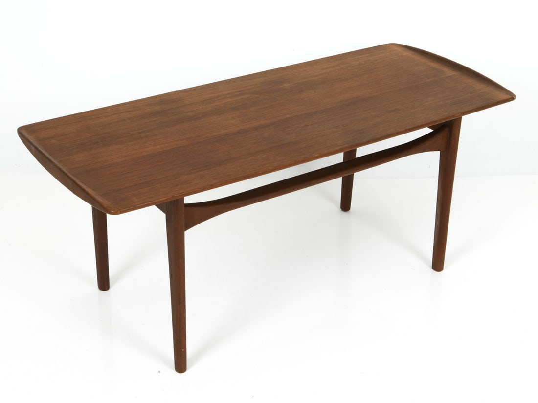 TOVE & EDVARD LARSEN DANISH TEAK COFFEE TABLE: Model FD503. For France & Son. Curved side corners. Marked underneath. Denmark, circa 1960s. Dimensions: H 20" x W 47.25" x D 20.5" Condition: Minor stress cracks to top, sun-fading to top, Wear consi