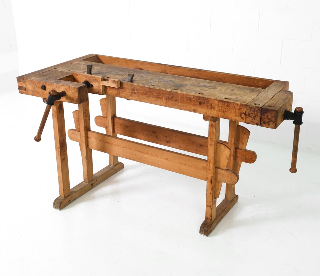 SCANDINAVIAN WOODEN CARPENTER'S WORKBENCH: Integrated tool and hand-hewn joints. Straight legs with stretcher base. Scandinavian, 20th century. Dimensions: H 32" x W 58.75" x D 30.25" Condition: Wear consistent with age and use including