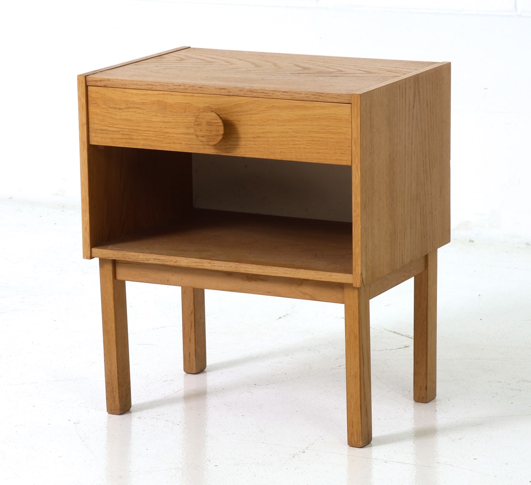 SCANDINAVIAN OAK NIGHTSTAND C. 1960S: Oak frame. Single drawer with recessed pulls over an open shelf. Scandinavian, circa 1960s. Dimensions: H 19.25" x W 17" x D 12" Condition: Wear consistent with age and use including minor scratches a