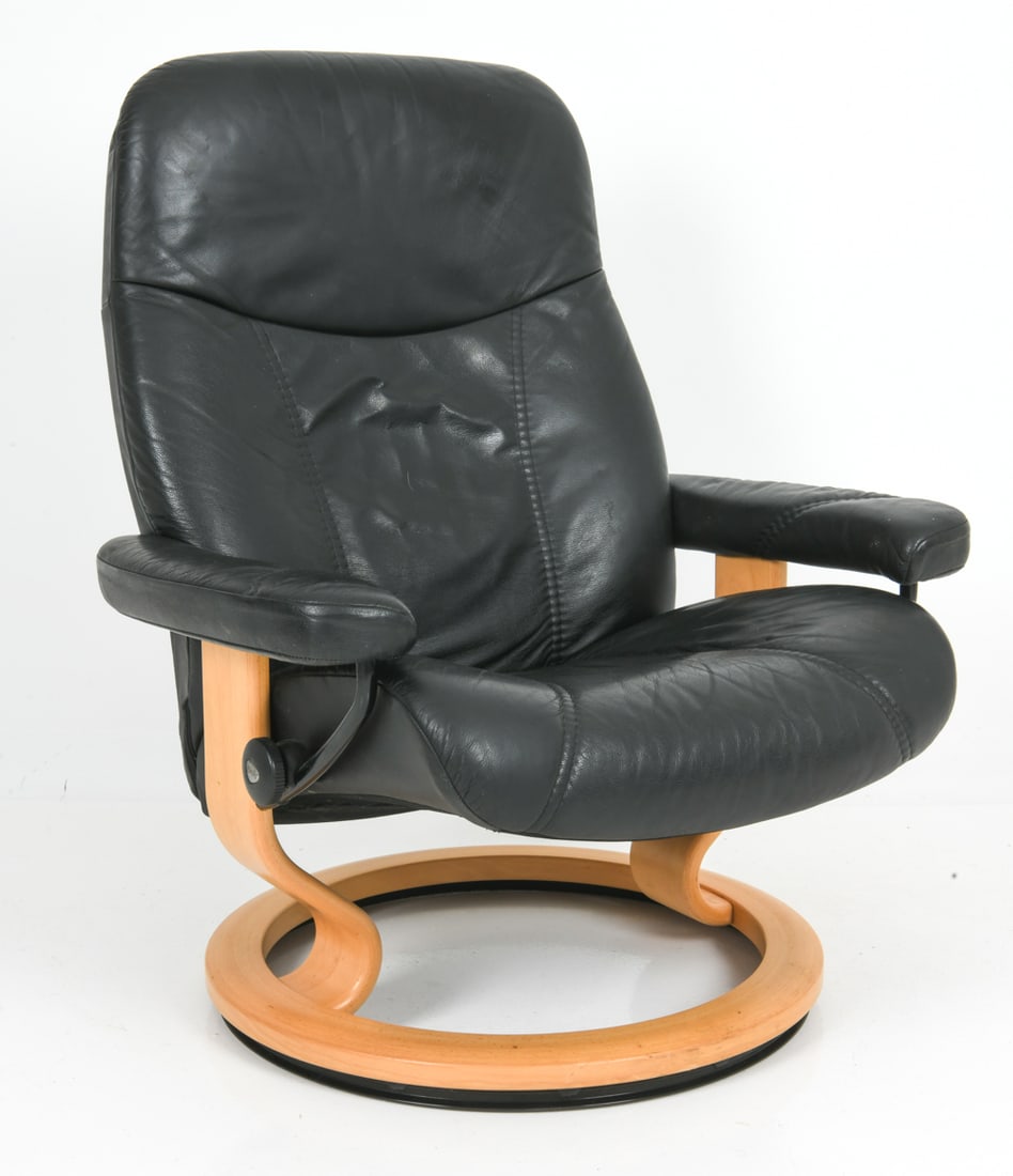 EKORNES STRESSLESS M. CONSUL LEATHER CHAIR 1970S: Round beech base with leather upholstery. Marked to hardware. Norway, circa 1970s. Dimensions: H 39.25" x W 33" x D 30" x Sh 16" Condition: Indents to back. Minor creasing to leather. Wear consistent