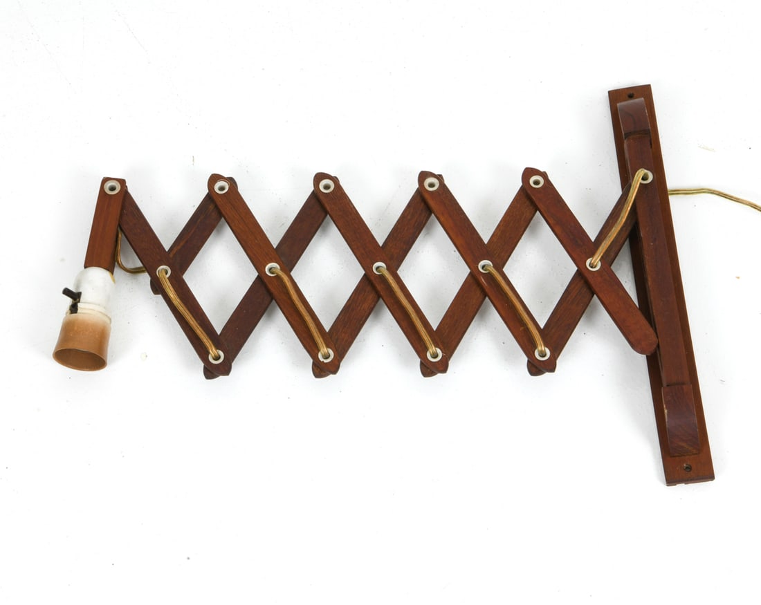 LE KLINT STYLE DANISH TEAK SCISSOR WALL SCONCE: Expandable arm in teak frame. Denmark, circa 1970s. Dimensions: H 13.75" x Dia. 9.25" Conditions: Not Tested, cord cut, Wear consistent with age and use.