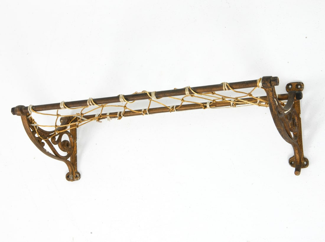 ANTIQUE SCANDINAVIAN LUGGAGE RACK: Antique luggage rack with net. Scandinavian. 20th century. Dimensions: H 7" x W 22.5" x D 8" Conditions: Wear consistent with age and use. Patina to metal and oxidizing.