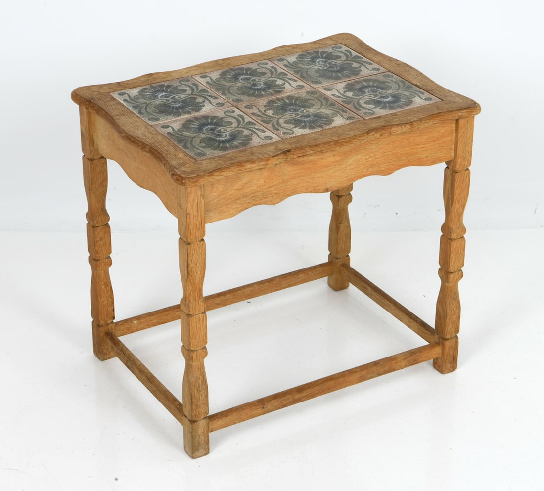 HENNING KJAERNULF STYLE OAK & TILE-TOP SIDE TABLE: Oak side table featuring an inset ceramic tile top with elaborate patterns. Dimensions: H 20" x W 21.75" x D 15.75" Condition: Wear consistent with age and use including water spots to top and legs,