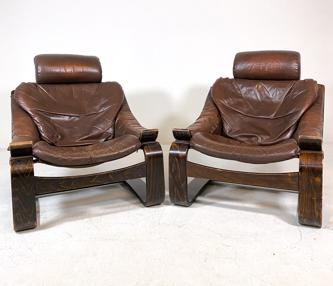 PAIR AKE FRIBYTTER FOR NELO "KROKEN" LOUNGE CHAIRS: For Nelo. Beech bentwood frames with brown leather upholstery. Sweden, circa 1970s. Dimensions: H 36.5" x W 29.5" x D 32" x SH 14". Condition: Slight drying to leather with scratches to both leather a