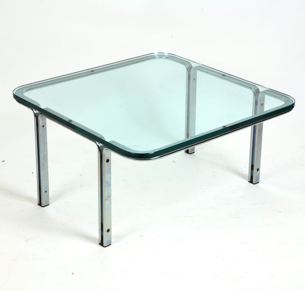 HORST BRUNING FOR KILL CHROM COFFEE TABLE C. 1960S: Glass and chromed flat steel frame coffee table or cocktail table by Horst Bruning for Kill International. Germany, circa 1960s. Dimensions: H 15.5" x W 30" x D 30" Condition: Remains of a previous la
