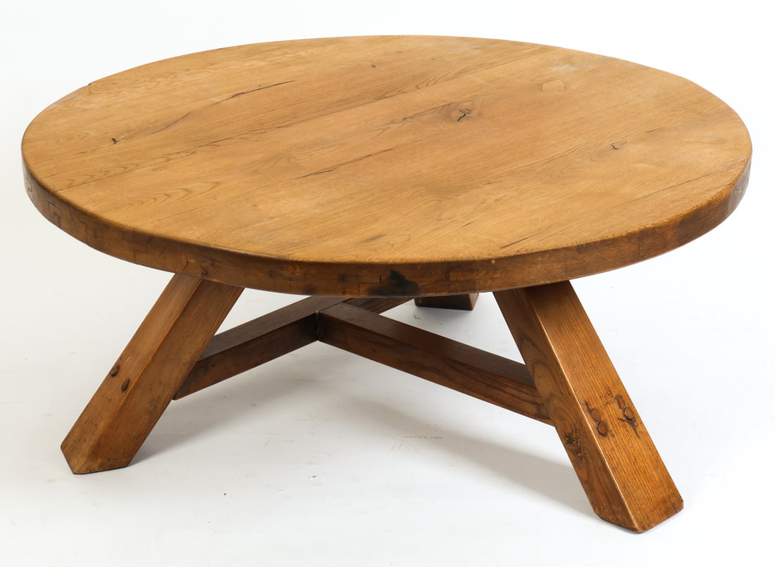 BRUTALIST DUTCH OAK COFFEE TABLE C. 1950S: Oak brutalist coffee table with tripod base with T-shape stretcher. Netherlands, circa 1950s. Dimensions: H 18.5" x Dia 40" Condition: Stress cracks to top. minor chip to edge. Nicks, dings and soling
