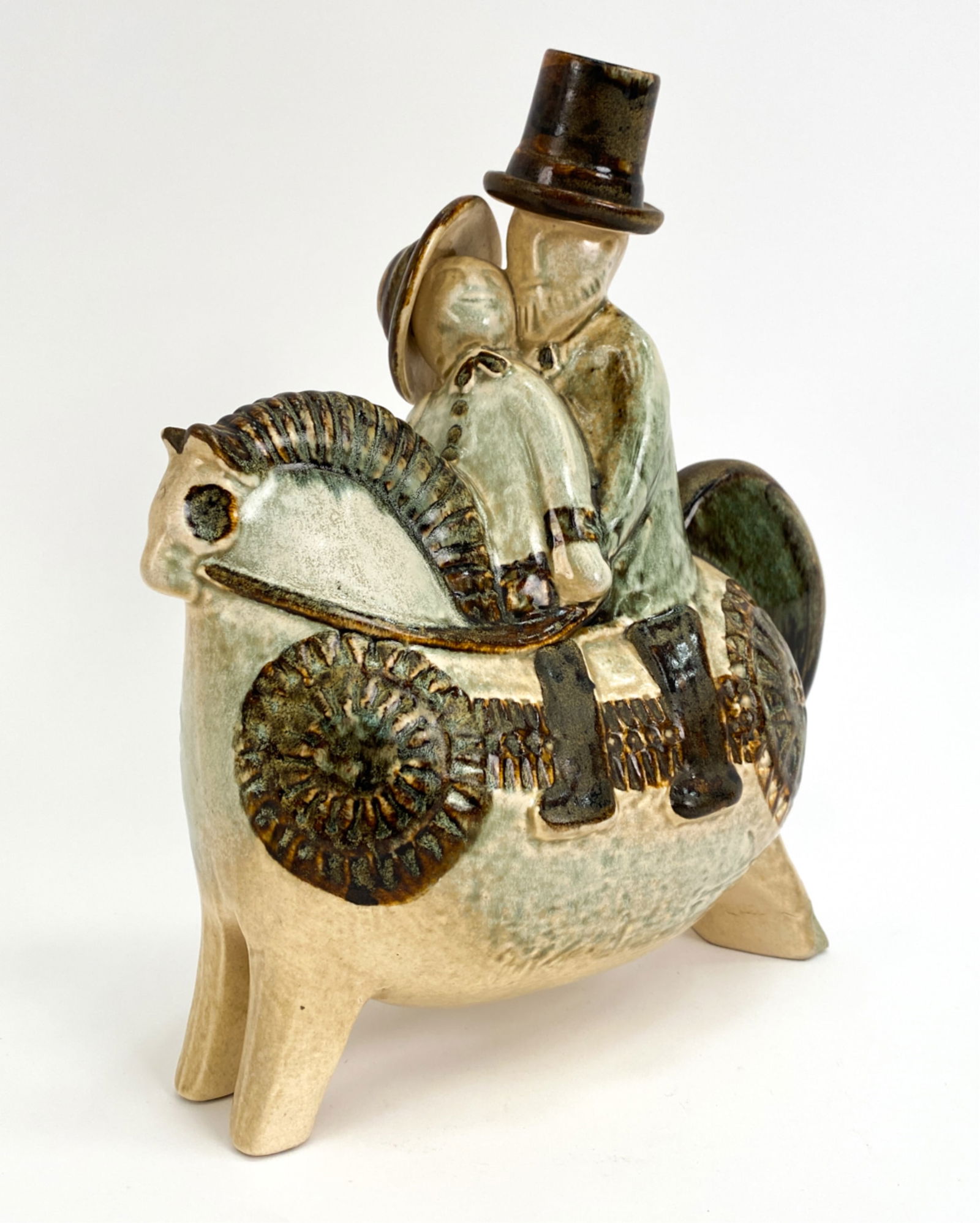 RARE JOSEPH SIMON SOHOLM DANISH CERAMIC: Depicting two figures in hats on horseback. Marked underneath Simon, 865. Circa 1960's. Dimensions: H 10.75" x W 9.5" x D 4.25" Condition: No issues to note. JE079