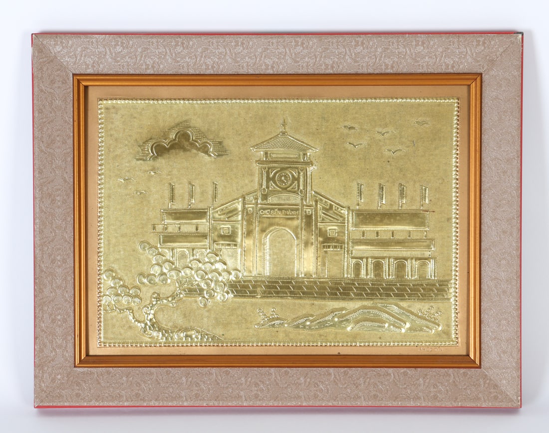 "CHO BEN THANH" BRASS RELIEF: This image depicts the architectural masterpiece of "Cho Ben Thanh". Signed Phuc Tin lower right. Dimensions: (Frame) H 13.25" x W 17.25" (Sight) H 9" x W 13" Condition: Minor loss at the corners and