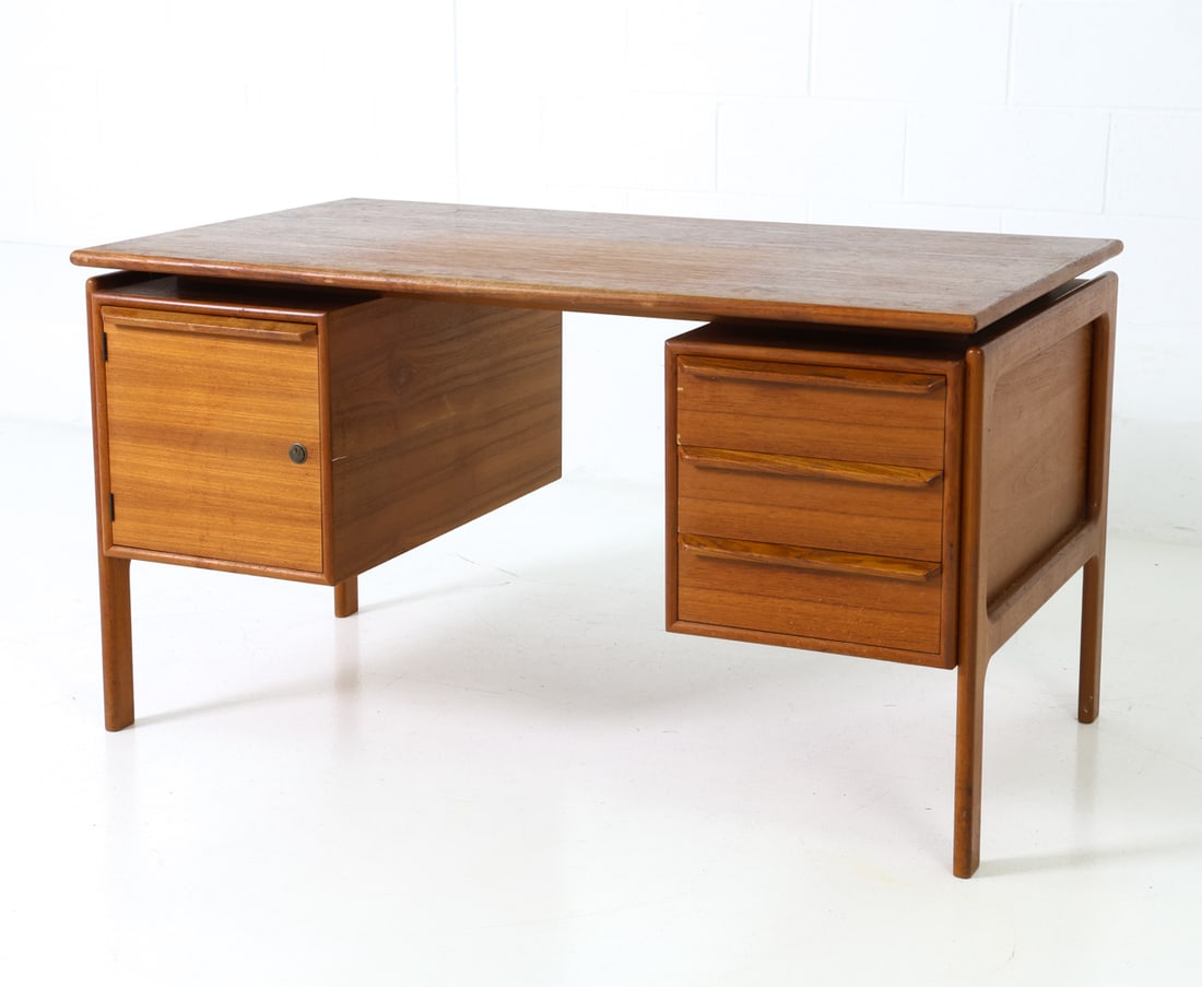 GV MOBLER DANISH TEAK WRITING DESK C. 1960S: Floating top desk in teak frame with drawers. Apparently unmarked. Denmark, circa 1960s. Dimensions: H 28" x W 51.5" x D 30 " Condition: Some scratches and scuffs. Fading. Wear consistent with age and