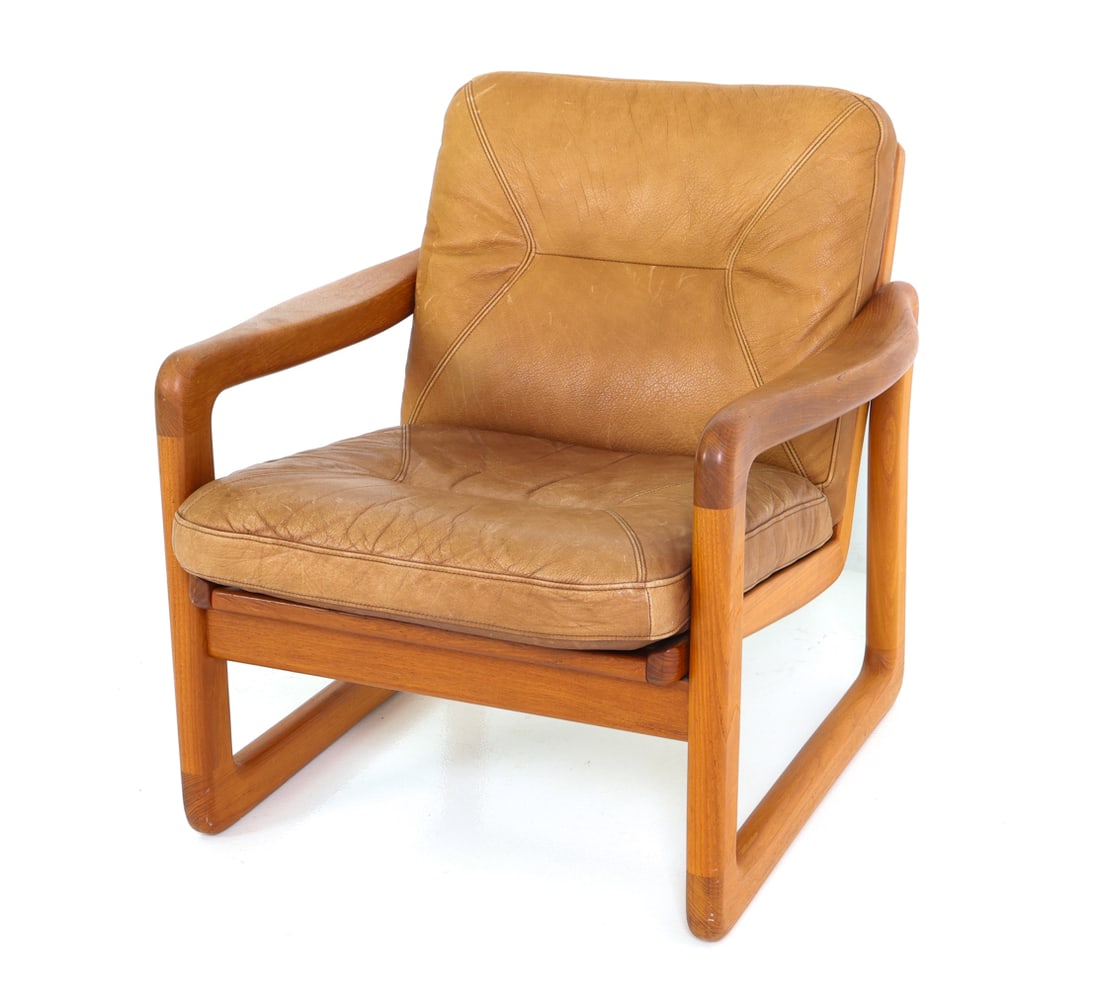 EMC MOBLER DANISH TEAK & LEATHER LOUNGE CHAIR: Lounge chair in teak frame and slatted back. Leather upholstered cushions. Apparently unmarked. Denmark, circa 1970s. Dimensions: H 30" x W 29" x D 30.5" x Sh 16.25" Condition: Wear consistent with ag