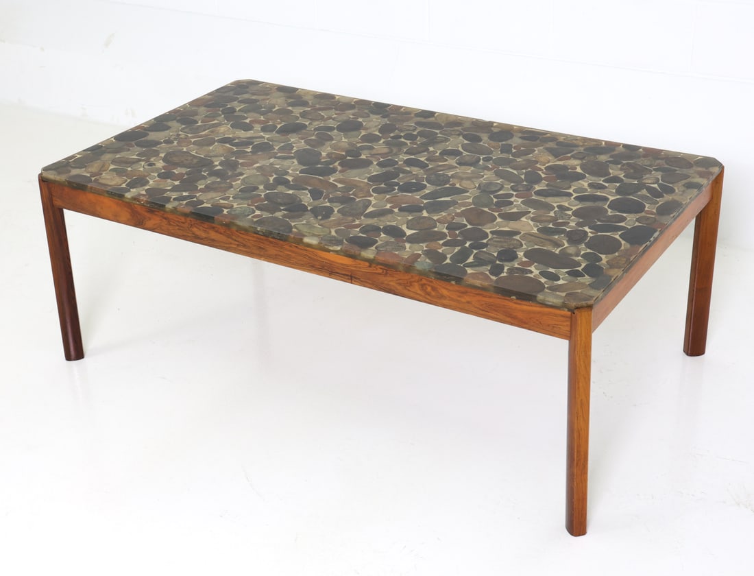 LARSEN STYLE ROSEWOOD & STONE RESIN COFFEE TABLE: Rosewood frame with resin-encased stone top. Denmark, circa 1960s. Dimensions: H 19" x W 52" x D 29.5" Condition: Wear consistent with age and use, including scuffs and nicks to top and legs.
