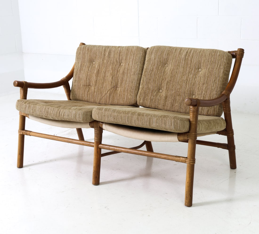 ATTR. HORSNAES DANISH BAMBOO LOVESEAT SOFA 1970'S: Curved bamboo construction with upholstered seat and backrest cushions. Apparently unmarked. Denmark, circa 1970s. Dimensions: H 28" x W 49" x D 29" x SH 15" Condition: Wear consistent with age and us