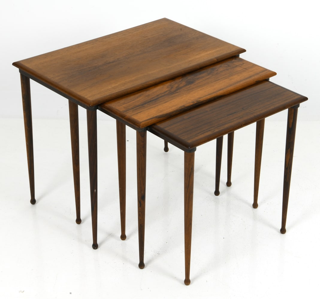 BC MOBLER VEJLE DANISH ROSEWOOD NESTING TABLES: Set of three rosewood nesting tables with "Drumstick legs", designed by BC Mobler for production by Vejle. Labeled on underside. Denmark, circa 1960s. Dimensions: (Largest) H 19.5" x W 23.5" x D 15" C