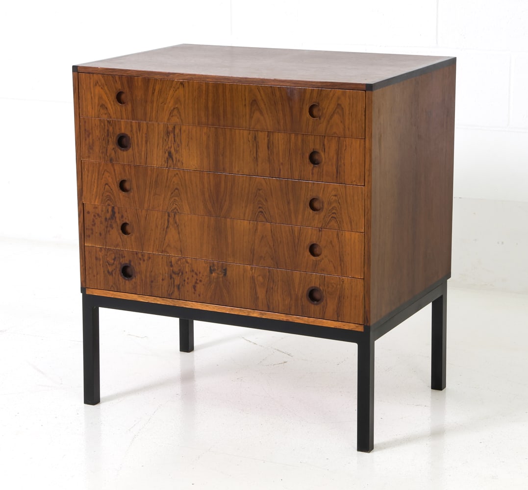 AKSEL KJERSGAARD FOR ODDER ROSEWOOD CHEST: Features 5 drawers with recessed pulls and rich grain pattern. Black painted metal base. Apparently unmarked. Denmark, circa 1960's. Dimensions: H 28" x W 25.5" x D 17.5" Condition: Wear consistent wi