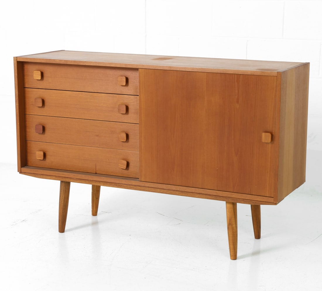 DOMINO MOBLER DANISH TEAK SIDEBOARD C. 1970S: Teak credenza or sideboard with drawers and square shaped pulls. Apparently unmarked. Denmark, circa 1970s. Dimensions: H 31" x W 48" x D 15.5" Condition: Minor dings and scratches to top and sides, W