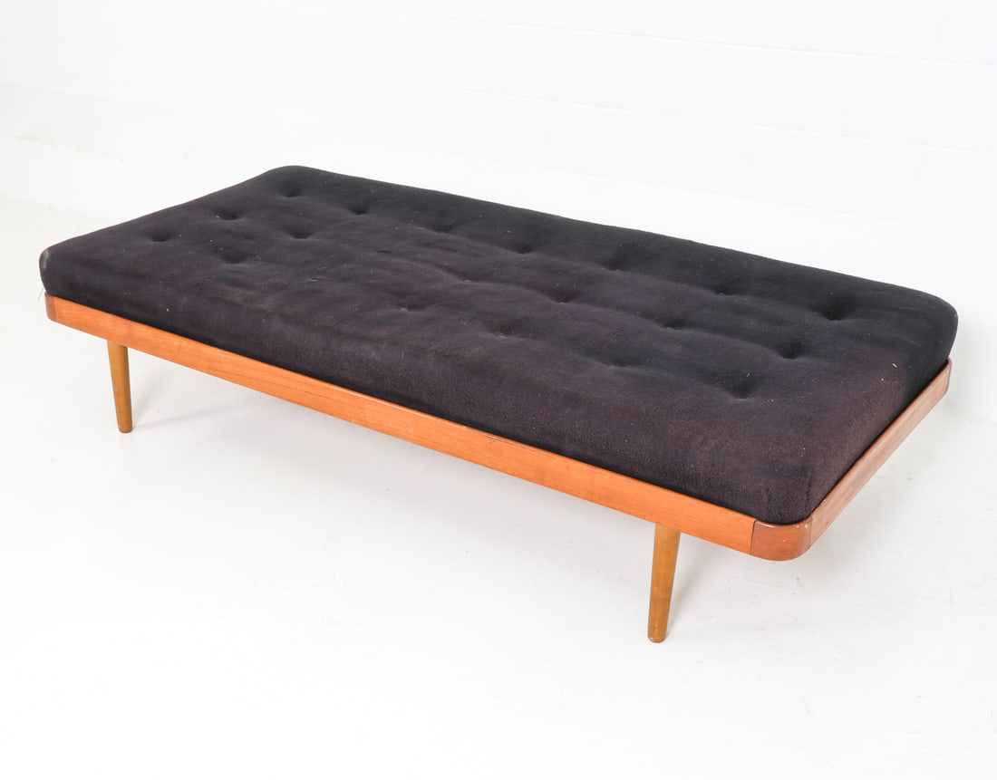 HORSNAES DANISH TEAK DAYBED C. 1960S: Teak frame with dark tone upholstered cushions. Marked to frame. Denmark, circa 1960s. Dimensions: H 16.5" x W 75" x D 33.5" Condition: Minor joint separation to one corner, minor scratches and rubs t