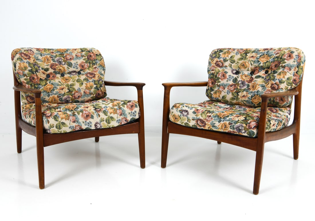 PAIR OF FOLKE OHLSSON SWEDISH TEAK LOUNGE CHAIRS: Sculptural teak frame and floral upholstered cushions. Sweden, circa 1960s. Dimensions: H 28.5" x W 29.25" x D 30" x Sh 17" Condition: Rubs and dings to wooden frame, Wear consistent with age and use.