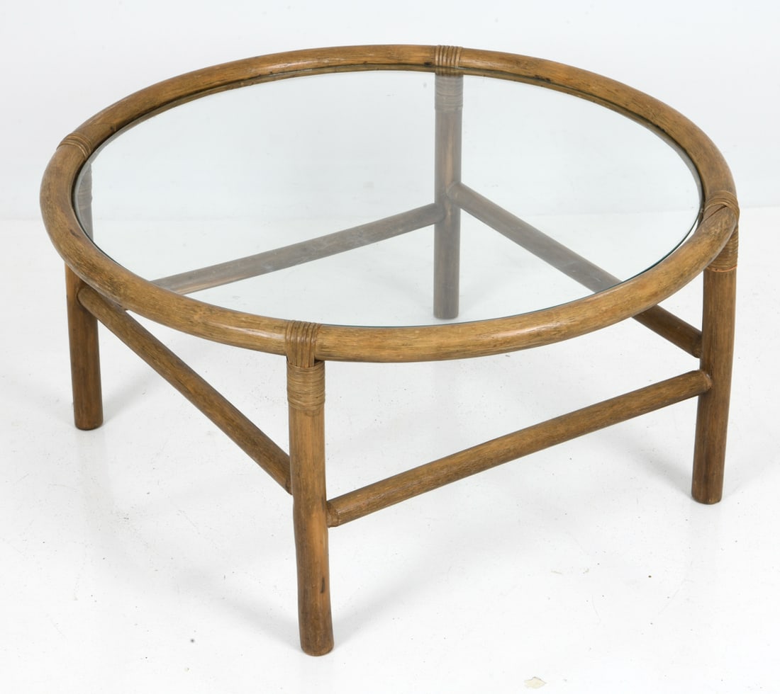 ATTR. HORSNAES DANISH BAMBOO COFFEE TABLE C. 1970S: Bamboo frame round coffee table with glass top. Apparently unmarked. Denmark, circa 1970's. Dimensions: H 17.5" x Diameter 35" Condition: Minor nicks to frame. Scuffs to glass. some splits and losses