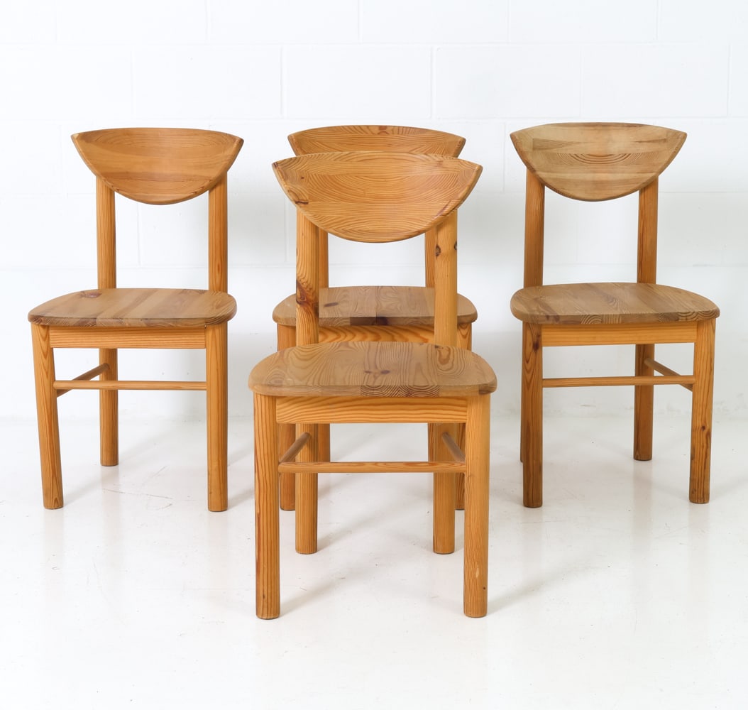 (4) RAINER DAUMILLER DANISH PINE CHAIRS C. 1970S: For Hirtshals. Cylindrical legs and half-moon curved backrests. Apparently unmarked, Denmark, circa 1970s. Dimensions: H 34" x W 18" x D 17" x SH 18" Condition: Wear consistent with age and use. Scuff