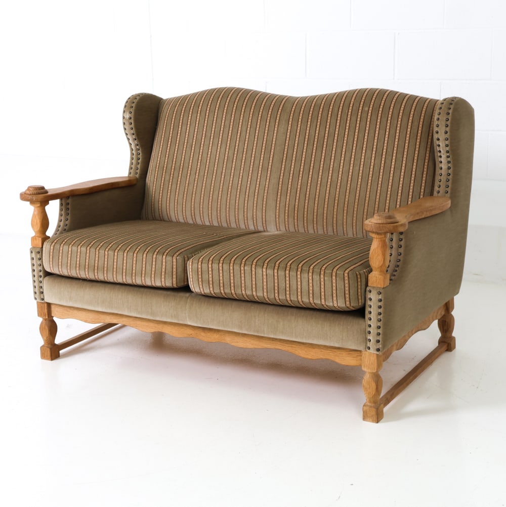 DANISH OAK & VELOUR LOVESEAT C. 1970S: Oak frame with velour upholstery and nailhead trim. Carved armrests and curved apron to front. Denmark, circa 1970s. Dimensions: H 32" x W 50" x D 30" x SH 16.5" Condition: Wear consistent with age an