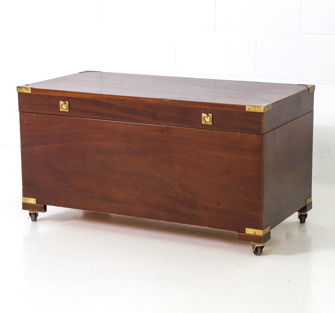SCANDINAVIAN MAHOGANY CAMPAIGN STYLE TRUNK: Early 20th Century Scandinavian campaign chest with brass details. In mahogany. Dimensions: H 20" x W 38" x D 19" Condition: Minor scuffs to top, rubbing to brass details. Few nicks to corners and edg