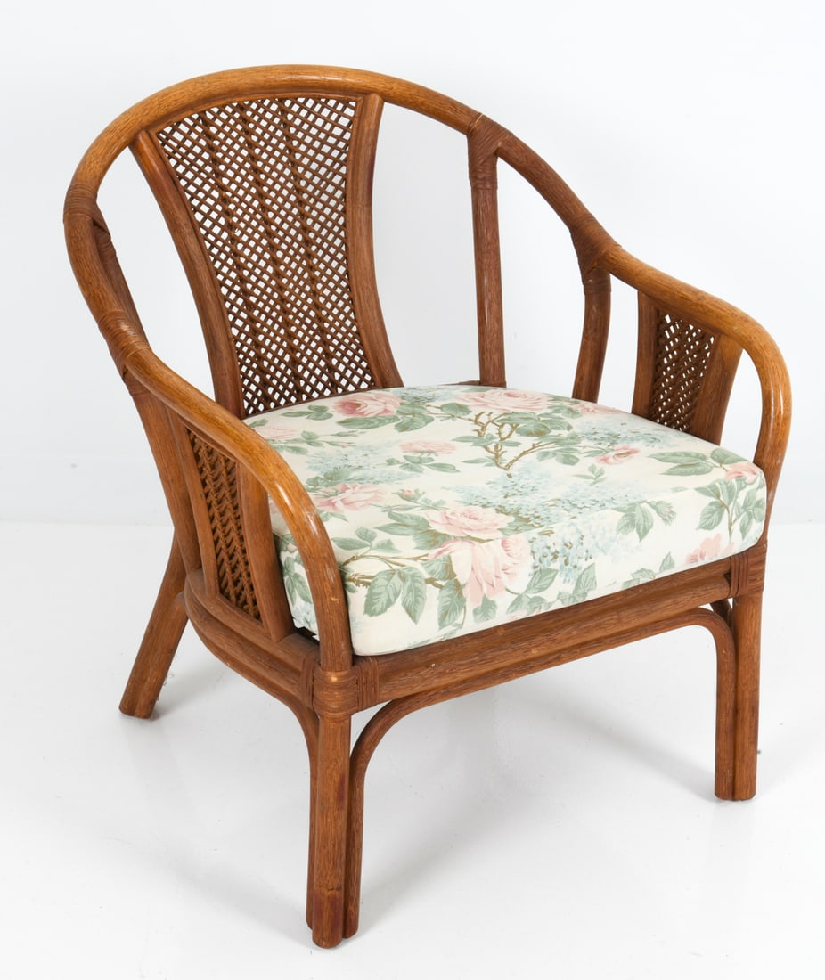 SCANDINAVIAN BAMBOO & RATTAN ARMCHAIR C. 1970S: Barrel form with bamboo frame and woven rattan backrest. Floral pattern upholstered cushion. Scandinavian, circa 1970s. Dimensions: H 31" x W 28" x D 27" x SH 19" Condition: Wear consistent with age a