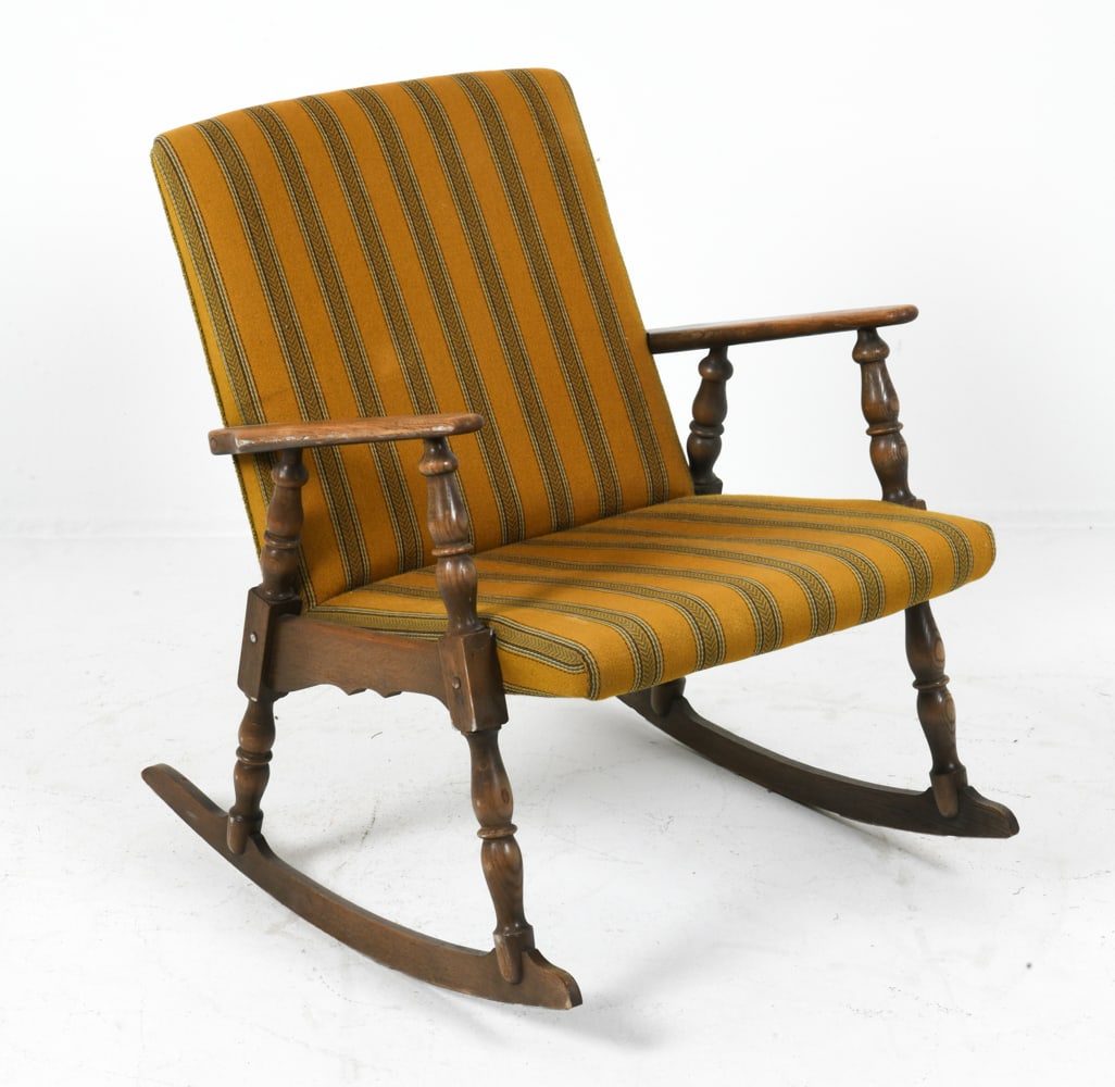 KJAERNULF STYLE DANISH OAK ROCKING CHAIR: Oak frame with yellow patterned upholstery. Denmark. Dimensions: H 30.75" x W 25.25" x D 28" x Sh 17". Condition: Wear consistent with age and use including minor rubs and scuffs to armrests and legs.
