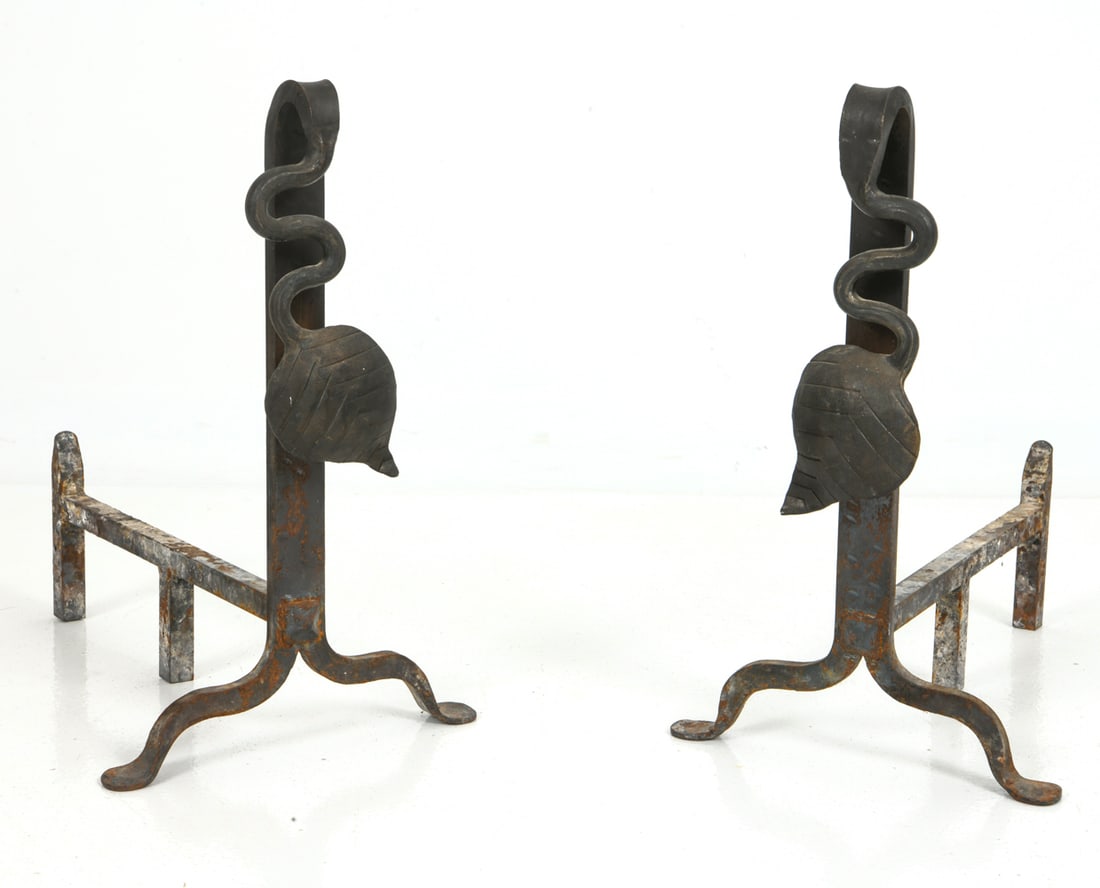 PAIR OF ANTIQUE WROUGHT IRON ANDIRONS: Pair of wrought iron andirons featuring spiral leaf motif. Apparently unmarked. Dimensions: H 17.75" x W 10.75" x D 17" Condition: Wear consistent with age and use including oxidation throughout.
