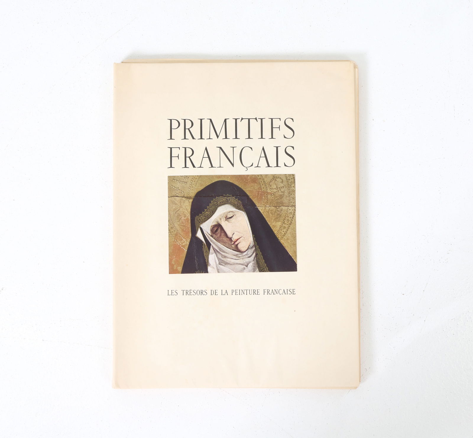 PRIMITIFS FRANCAIS BY GERMAIN BAZIN BOOK: Vintage book featuring illuminations and paintings from the 14th and 15th centuries. Circa 1948. Dimensions: H 15.25" x W 11.5" x D 1" Condition: Age toning to papers, light surface marks consistent