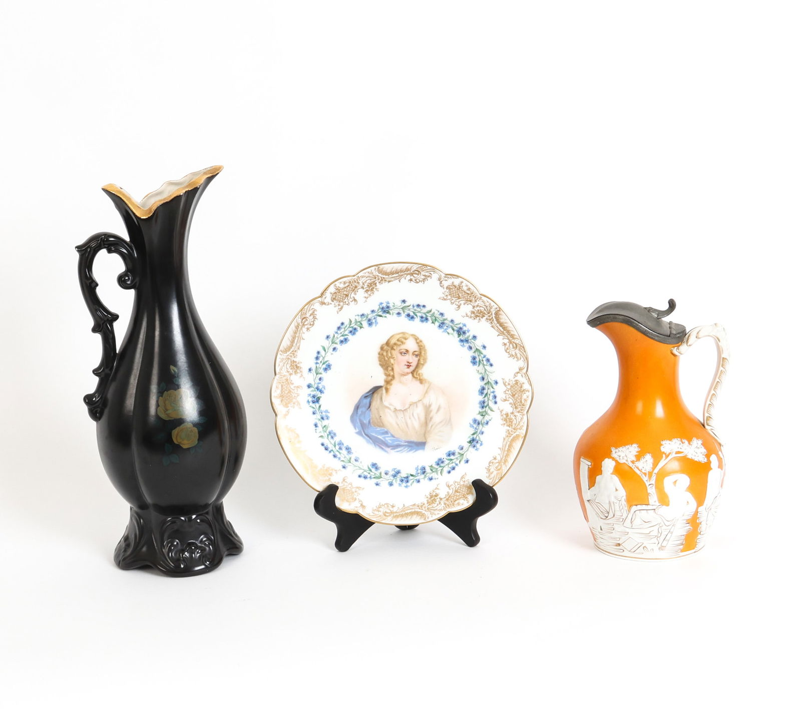 DECORATIVE EUROPEAN PORCELAIN GROUPING: Grouping includes a Sevres 1846 Chateau de St Cloud Lady Portrait plate and two pitchers. Stamped on underside of plate. Dimensions: (Tallest) H 14" x W 5" x D 6" Condition: Wear consistent with age a