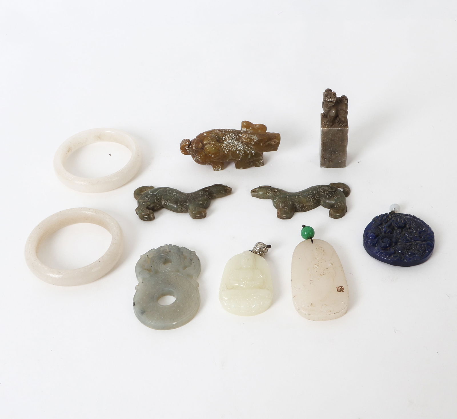 VINATGE CHINESE JADE AND HARDSTONE GROUPING: Vintage Chinese jade and hardstone carvings,including mythical animals, figures, and pendants. Dimensions: (Largest) H 1.5" x W 3.25" x D 1" Condition: Wear consistent with age and use including dings