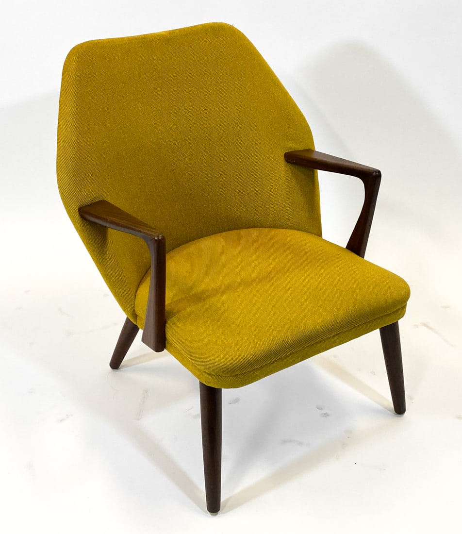 KURT OLSEN STYLE DANISH TEAK LOUNGE CHAIR 1960S: Teak arms and legs with shaped backrest and yellow wool upholstery. Denmark, circa 1960s. Dimensions: H 31.75" x W 26.5" x D 27" x Sh 15". Condition: Minor marks of discoloration to tip of backrest.
