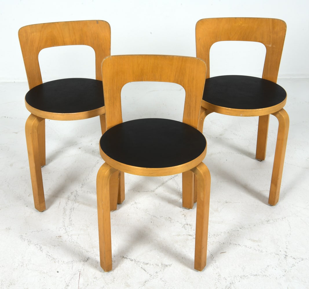 (3) ALVAR & AINO AALTO N66 DINING CHAIRS: Lacquered birch legs with black linoleum seats. Apparently unmarked. Denmark, circa 1960s. Dimensions: H 16.25" x W 13.75" x D 14.5" x Sh 17.75". Condition: Minor dings and rubs to backrest and seat,