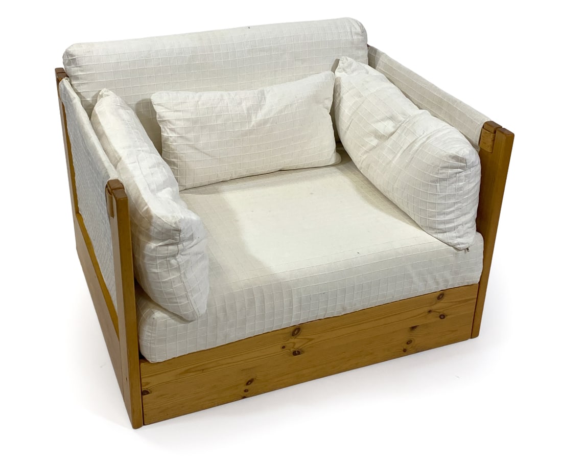 STYLE OF APELDOORN DUTCH PINE LOUNGE CHAIR 1970S: Pine frame with white upholstery and cushions. Leather straps for accents. Netherlands, circa 1970s. Dimensions: H 24" x W 37" x D 32" x SH 16.5". Condition: Minor scuffs and dings to wood., few