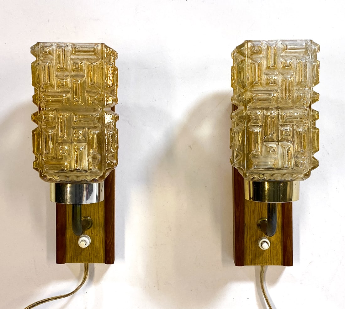 PAIR OF DANISH TEAK & CRYSTAL WALL SCONCES C. 1960: (2) Wall sconces with teak backings and crystal glass shades. Denmark, circa 1960s. Dimensions: H 9" x W 3.5" x D 5". Condition: Wiring untested. Scuffs and rubs to brass. Wear consistent with age
