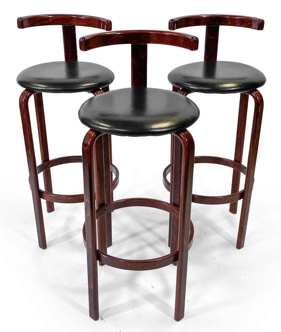 (3) GEORG PETERSENS BEECH & LEATHER BAR STOOLS: Bentwood beech frame with black leather upholstery. Tagged under seat. Denmark, circa 1970s. Dimensions: H 40.5" x W 16.75" x D 18.5" x Sh 32.25". Condition: Minor dings and rubs to backrest and