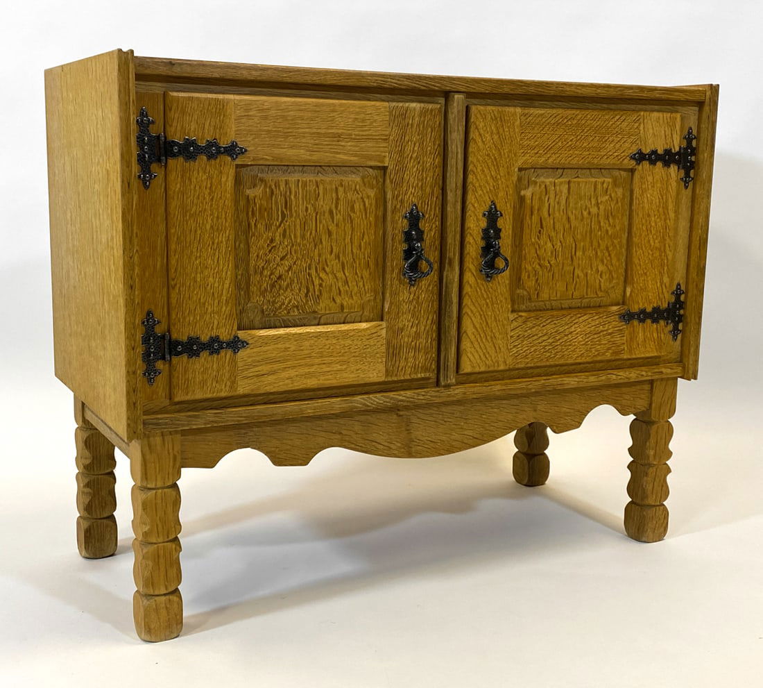 STYLE OF KJAERNULF DANISH OAK CABINET C. 1970S: Oak cabinet with iron hinges and ring pulls. Denmark, circa 1970s. Dimensions: H 28" x W 35.5" x D 16.25". Condition: Minor rubs and scuffs to side and top, Wear consistent with age and use.