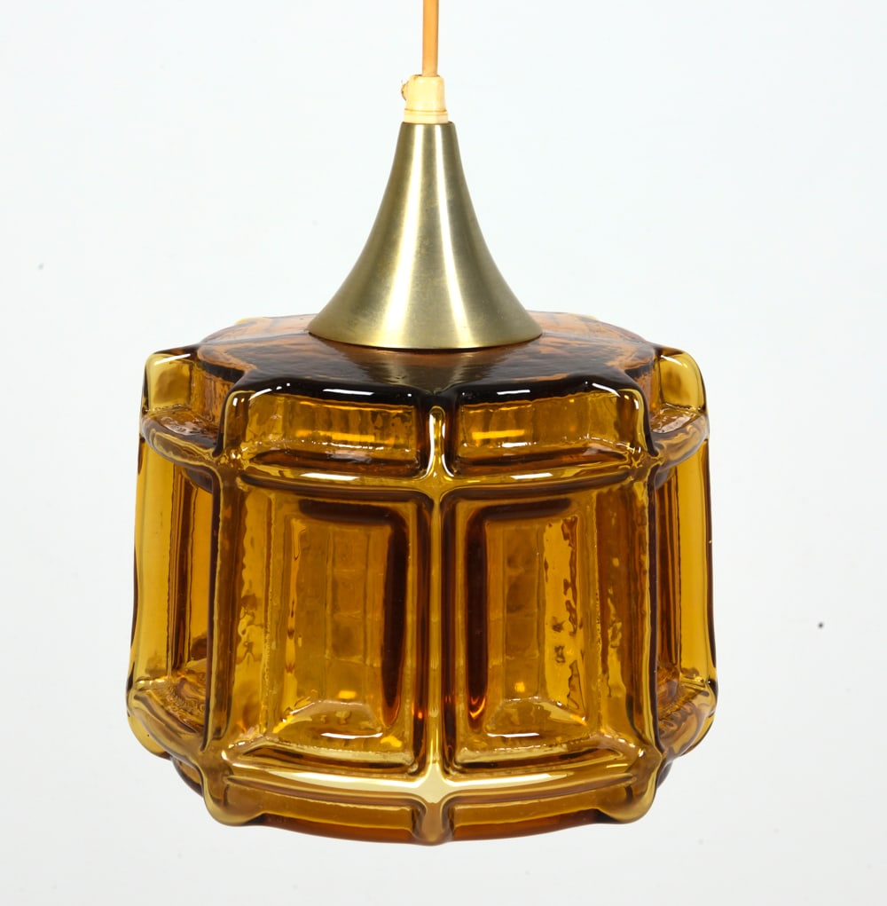 DANISH AMBER GLASS PENDANT LIGHT C. 1960S: Amber glass shade with brass accent. Denmark, circa 1960s. Dimensions: H 10" x Dia. 7.5". Condition: Wiring untested, few minor scuffs to glass and metal. Wear consistent with age and use.