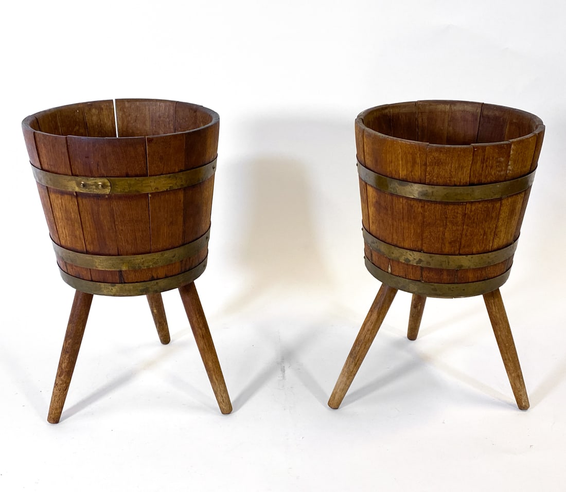PAIR OF SCANDINAVIAN OAK BARREL PLANTERS C. 1970S: (2) Small barrel planters. Oak with metal rings. Scandinavian, circa 1970s. Dimensions: H 17" x Dia. 10". Condition: Slats are loose. Scuffs and scratches to wood and metal Wear consistent with age