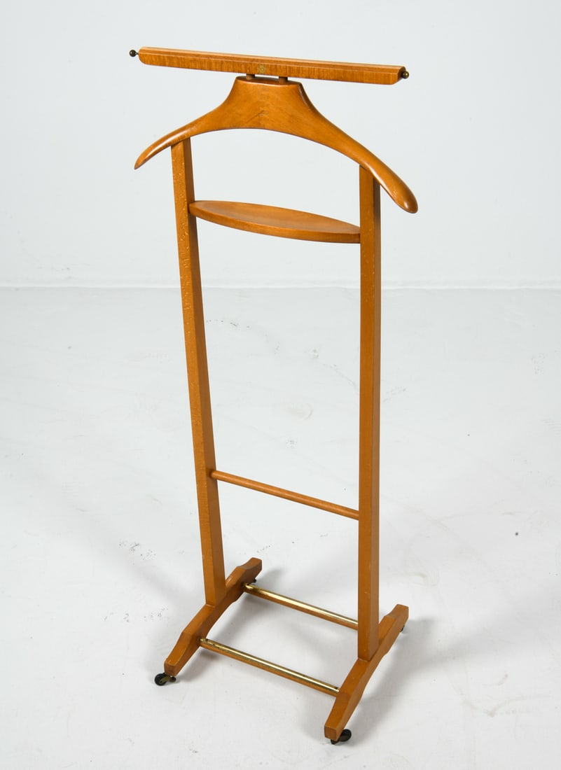 FRATELLI REGUITTI ITALLIAN BEECH VALET STAND 1970S: Marked to top bar. Beech with with brass accents. Italy, circa 1970s. Dimensions: H 41" x W 17.5" x D 12.75". Condition: Minor rubs and scratches to frame, Wear consistent with age and use.