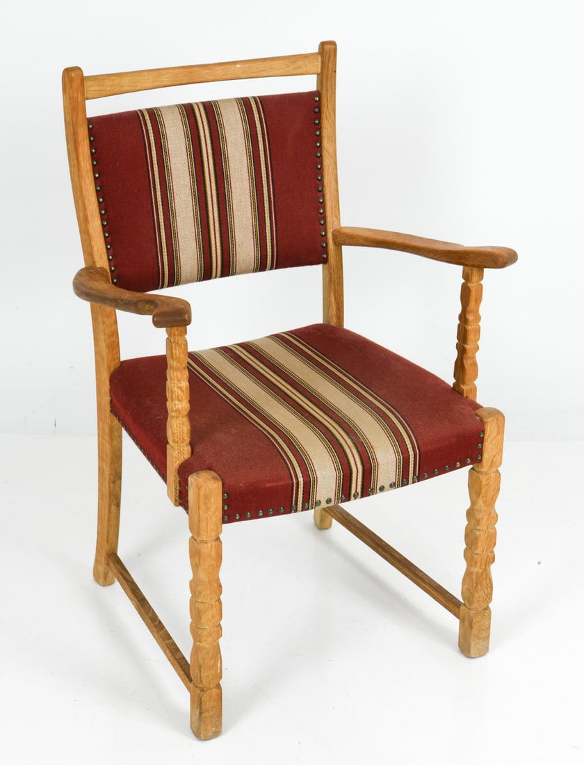 STYLE OF KJEARNULF DANISH OAK ARMCHAIR C. 1970S: Brutalist oak armchair with striped upholstery and nail head trim. Denmark, circa 1970s. Dimensions: H 36" x W 23.25" x D 19" x SH 18" Condition: Wear consistent with age and use. Light rubbing and su