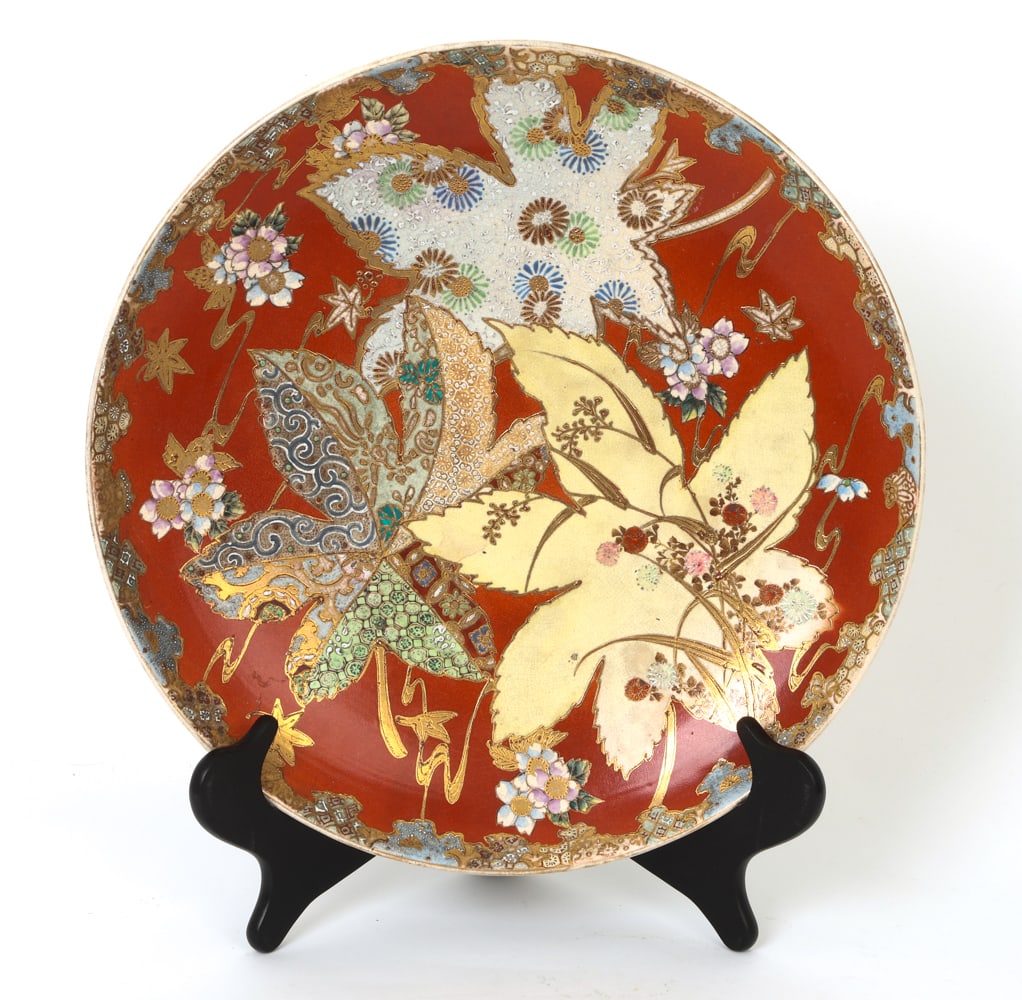 JAPANESE SATSUMA PORCELAIN CHARGER: Japanese charger featuring floral motif and intricate gilt details. Dimensions: Dia 15.5" Condition: Wear consistent with age and use.