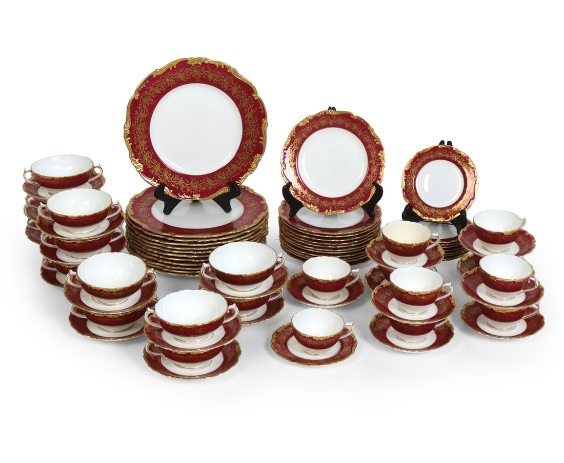 COALPORT HAZELTON GILT ENGLISH PORCELAIN SERVICE: Hazelton Maroon pattern porcelain service. Red border with gold foliate vine and floral motifs decoration and scalloped rim. 12 dinner plates, 12 luncheon plates, 10 dessert plates, 12 soup bowls with