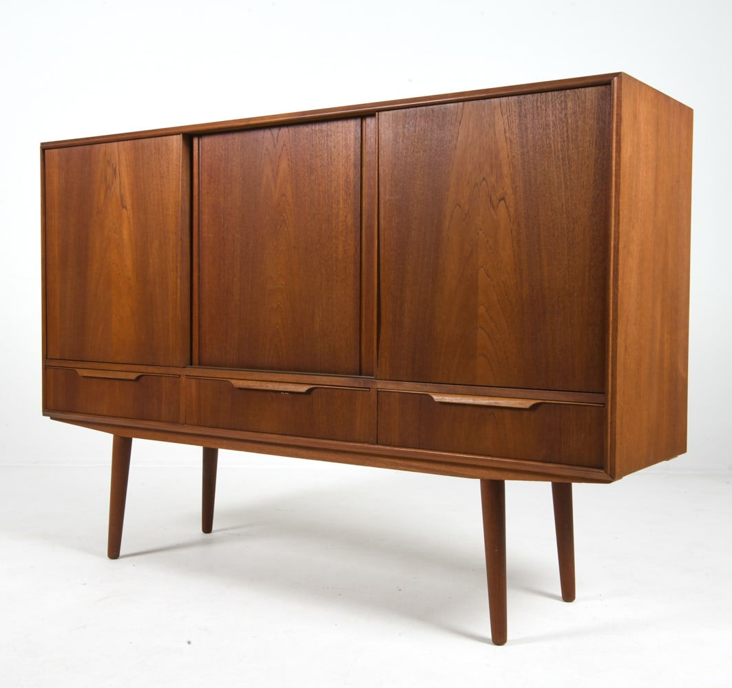 E W BACH FOR SEJLING DANISH TEAK SIDEBOARD C.1960S: Adjustable shelves. Dry bar to left cabinet with frosted decorated mirror. Apparently unmarked. Denmark, circa 1960s. Dimensions: H 44.5" x W 65" x D 17.5". Condition: Minor scratches and few faint