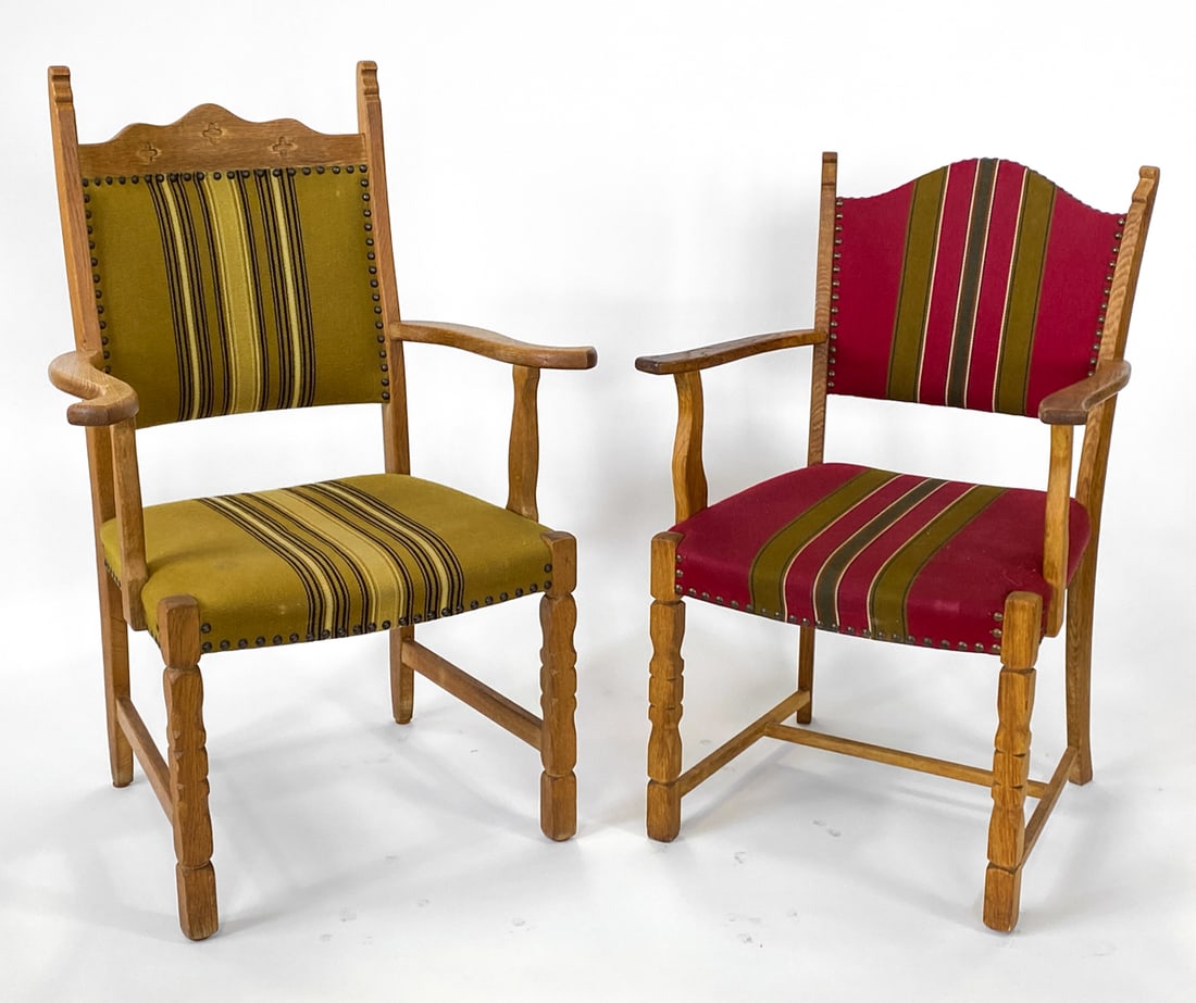 (2) STYLE OF KJAERNULF OAK DINING CHAIRS C. 1970S: (2) Oak frames with green and red upholstery. Carved detailing to back of one chair. Denmark, circa 1970s. Dimensions: Tallest H 41.5" x W 28.5" x D 21" x SH 18". Condition: Minor scuffs to wood, few