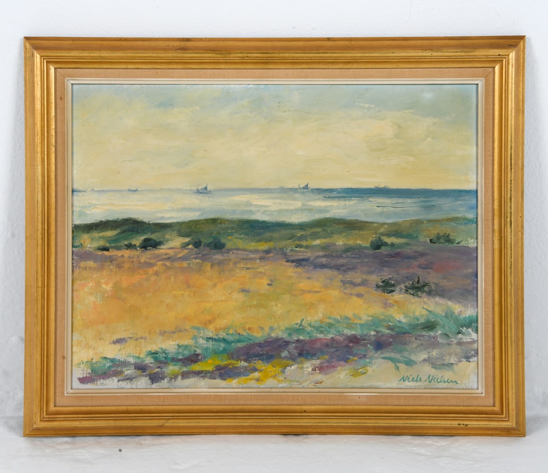 NIELS NIELSEN (20TH C.) BEACH LANDSCAPE O/C: Signed to lower right corner. Landscape of a shoreline with boats in background. Oil on canvas. Denmark, mid 20th century. Dimensions: Frame H 19" x W 24.25". Canvas H 15.5" x W 20". Condition: Minor